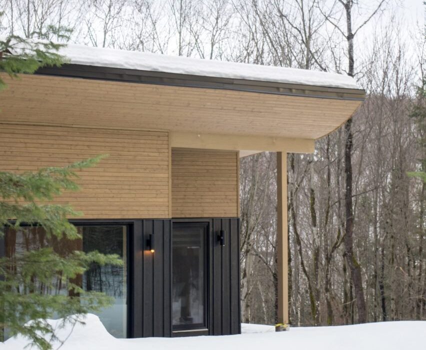 Stephane GaulinBrown places curved roof on Quebec chalet Zarkon